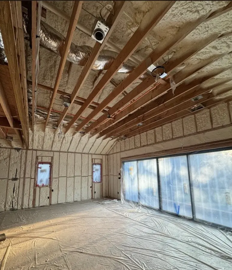 Interior walls and ceiling insulated with spray foam during new construction in Oakleaf Plantation